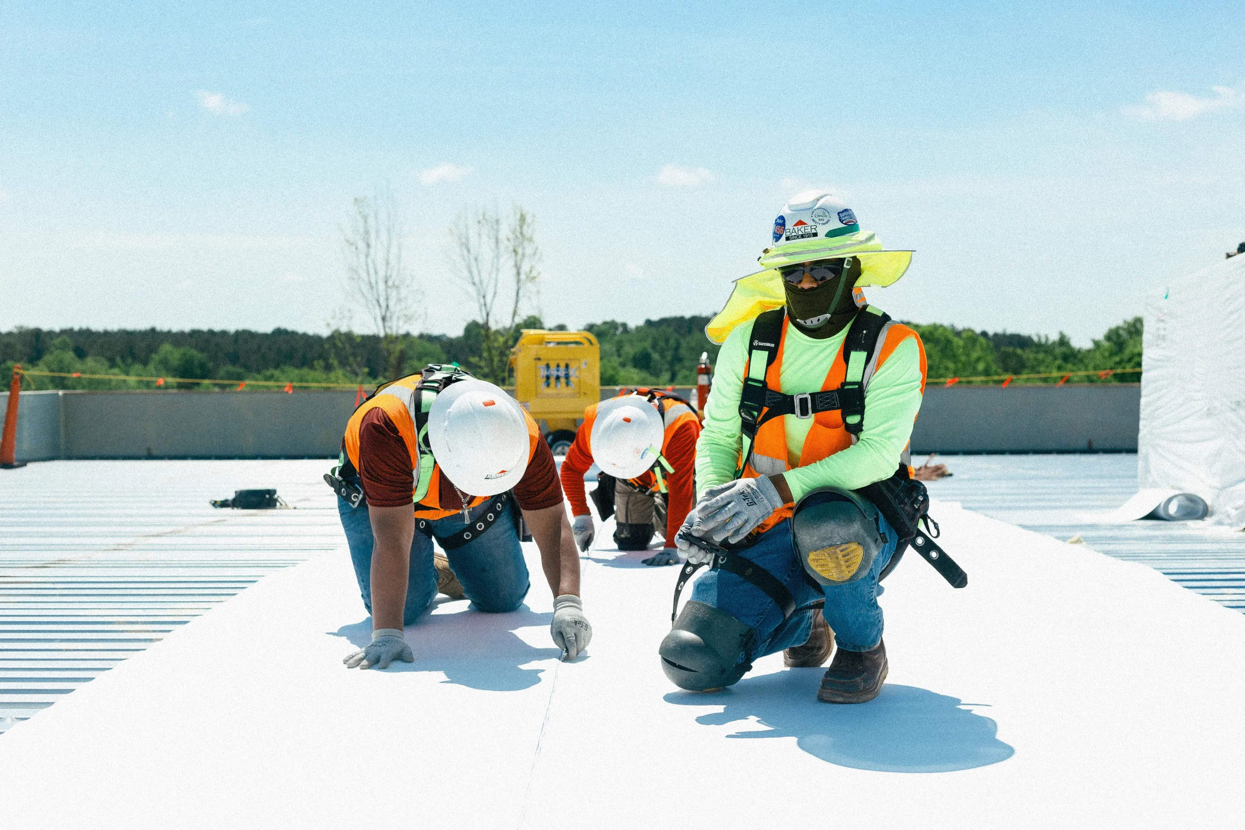 Home-improvement professionals working on a roof